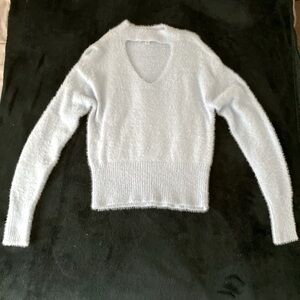 Open neck fuzzy baby blue sweater with cinched/elastic waist. Long sleeves.